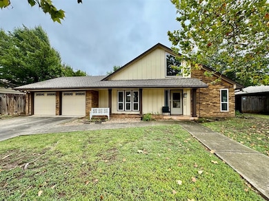 View of front facade featuring roof with shingles, a porch, a garage, and driveway