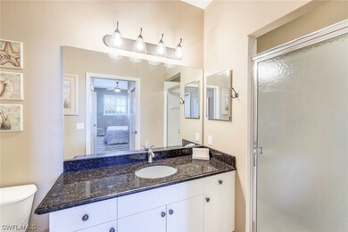 Master Bath has a walk in shower, grante topped va