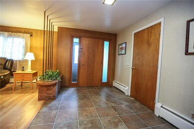 Entry way from front and garage has coat closet as