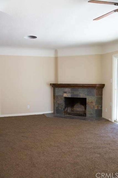The Living Room Area with Fireplace.