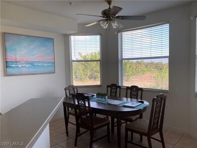 Dining room with light tile patterned flooring, ce