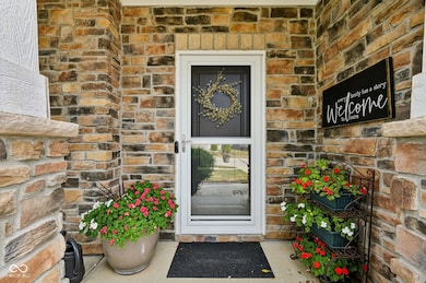 entrance to property featuring stone siding