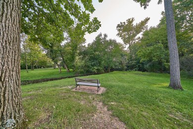 ox park bench overlooking creek