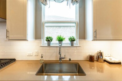 Kitchen with plenty of natural light, tasteful bac