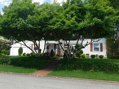 Exterior Front. professionally landscaped and fram