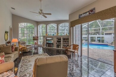 Family room with pool view. Lots of natural light.