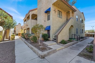 View of property with stairway and a residential v