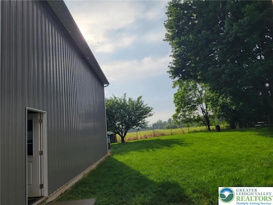 Garage side door and view of yard