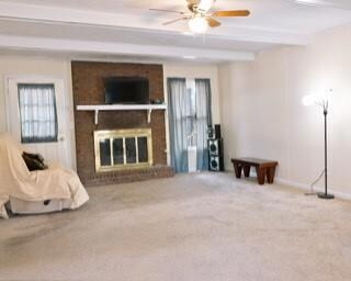 Unfurnished living room with a brick fireplace, ca