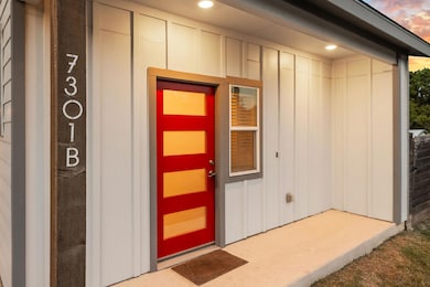 View of exterior entry featuring board and batten