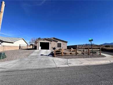 Ranch-style home with a mountain view and a garage
