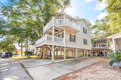 View of front of home featuring a balcony and a ca