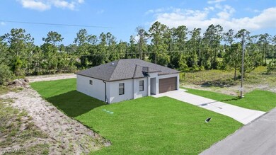 View of front of house featuring driveway, a front