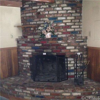 Brick fireplace in family room. 