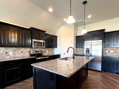 Kitchen with sink, appliances with stainless steel