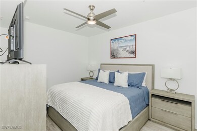 Bedroom featuring a ceiling fan and light wood-type flooring
