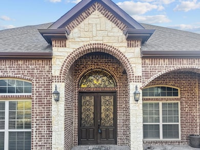 Doorway to property featuring french doors