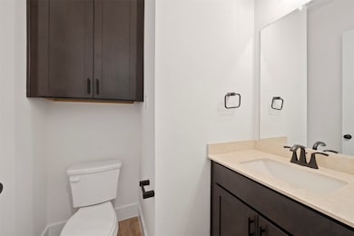 Bathroom with vanity and wood finished floors