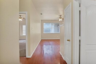 Hall with hardwood / wood-style flooring