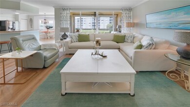 Sunny living room with sliders to the balcony.