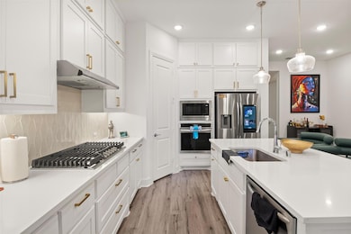 Kitchen with appliances with stainless steel finis