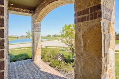 View of patio featuring a water view