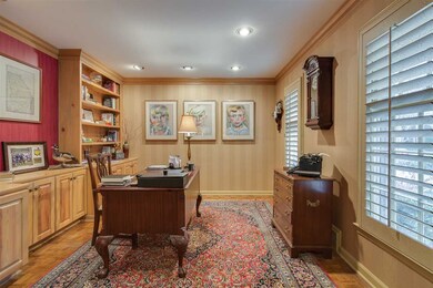 Entry hall leads to wonderful study with wall of b