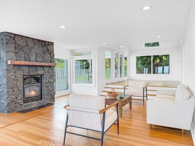Natural light, cozy natural lava rock fireplace and clear fir harwood floors texture the great room with charm.