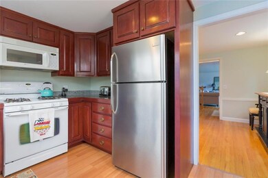 Beautiful cabinets and entry to...