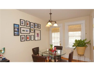 Sunny front room overlooks front balcony. Perfect 