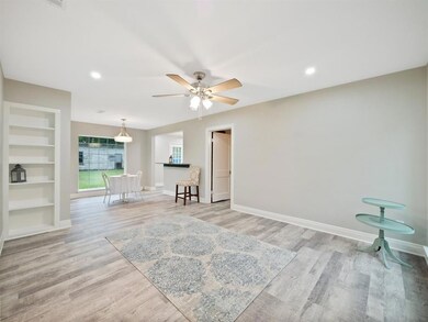 Open Living and Dining area with built ins.