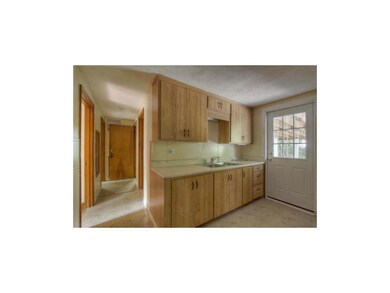 Sunny Kitchen with Door to Carport for Easy Access