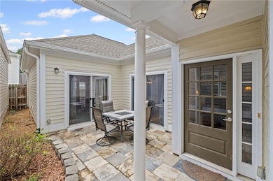 View of patio featuring outdoor dining space and fence