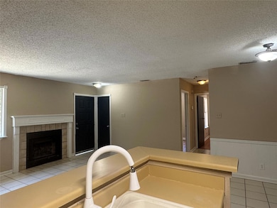 Kitchen featuring light tile patterned floors, a 