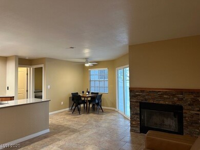 Living room with custom tile throughout the unit.