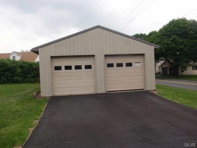 Dedtached 2 car pole barn garage with 9 foot door 