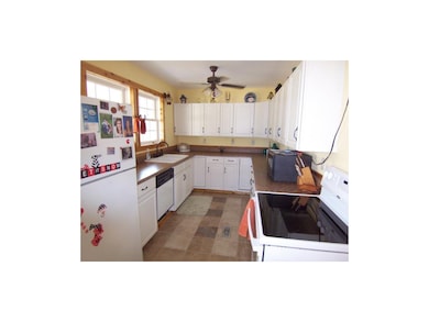 Kitchen showing Lots of Cabinets, Ceiling Fan & Do