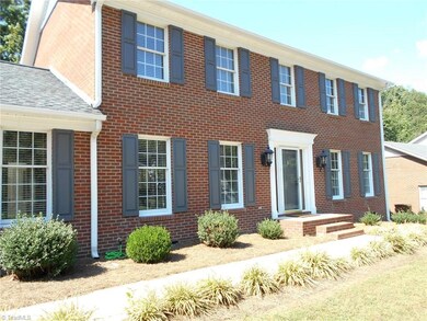 Brick home with vinyl trim