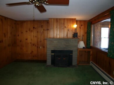 Living Room. Woodburning fireplace with insert.