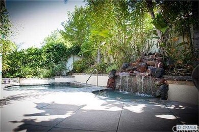 Lovely backyard with pool and waterfall