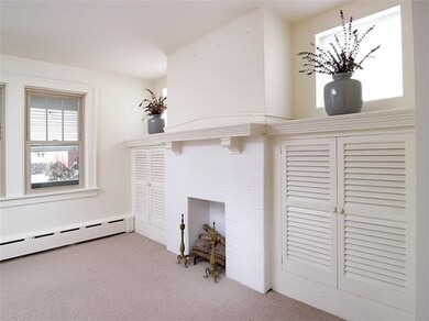 Living room with decorative fireplace and built in