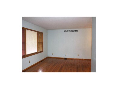 Hardwood floors, L-shaped living room  into dining