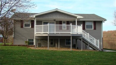18'x20' Covered deck, vinyl rails, solar lights and stairs leading to new walkway, level yard and additional det/grg