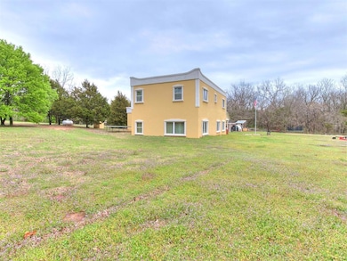 View of side of home with a yard