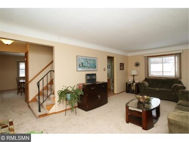 Main level living room with walk-in to formal dini