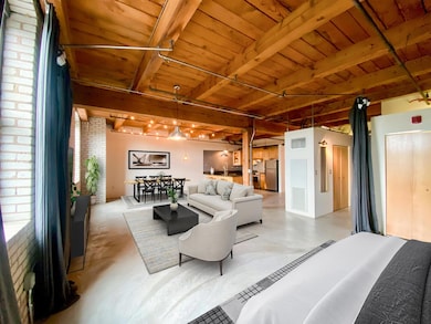 Virtually staged to illustrate one way this large, open condo may be furnished.