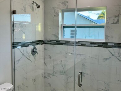 Bathroom featuring toilet and a shower with shower