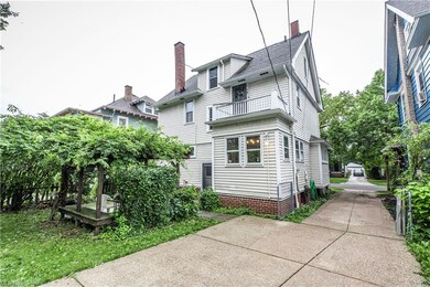 View of property exterior with balcony