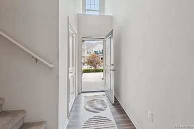 Entryway w/ coat closet & vaulted ceilings