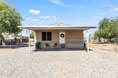 FRONT WITH CARPORT